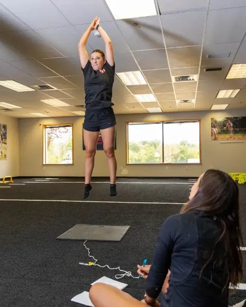 Female athlete performing speed and agility training at Relentless Athletics gym