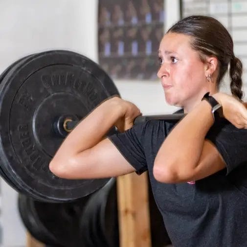 Female athlete front squat at Relentless Athletics