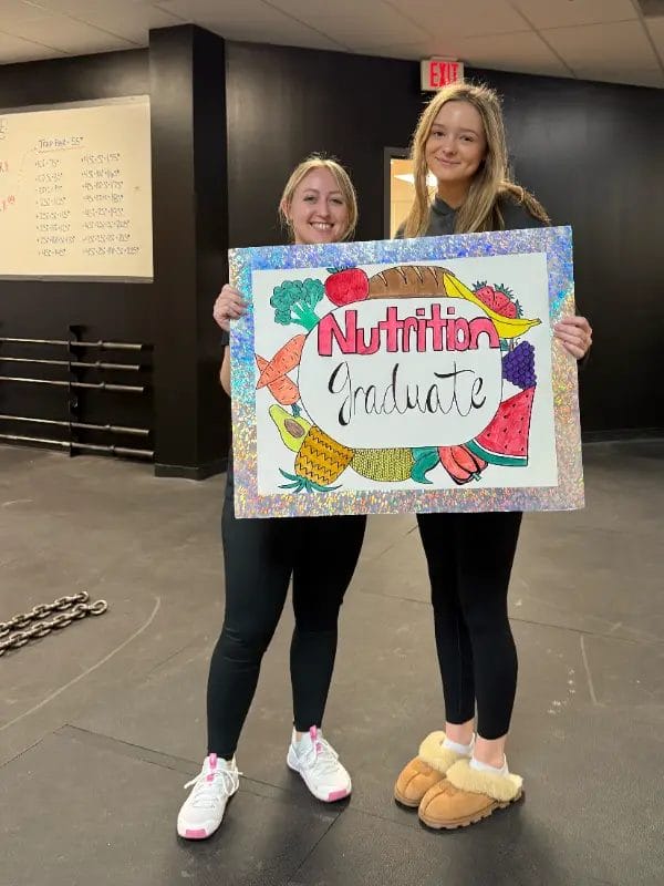 Fitness client at Relentless Athletics showing transformation progress inside the gym